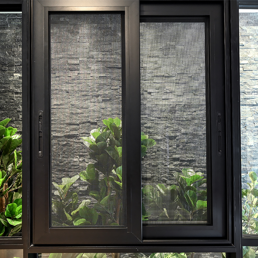 Black security window screens installed on a modern home