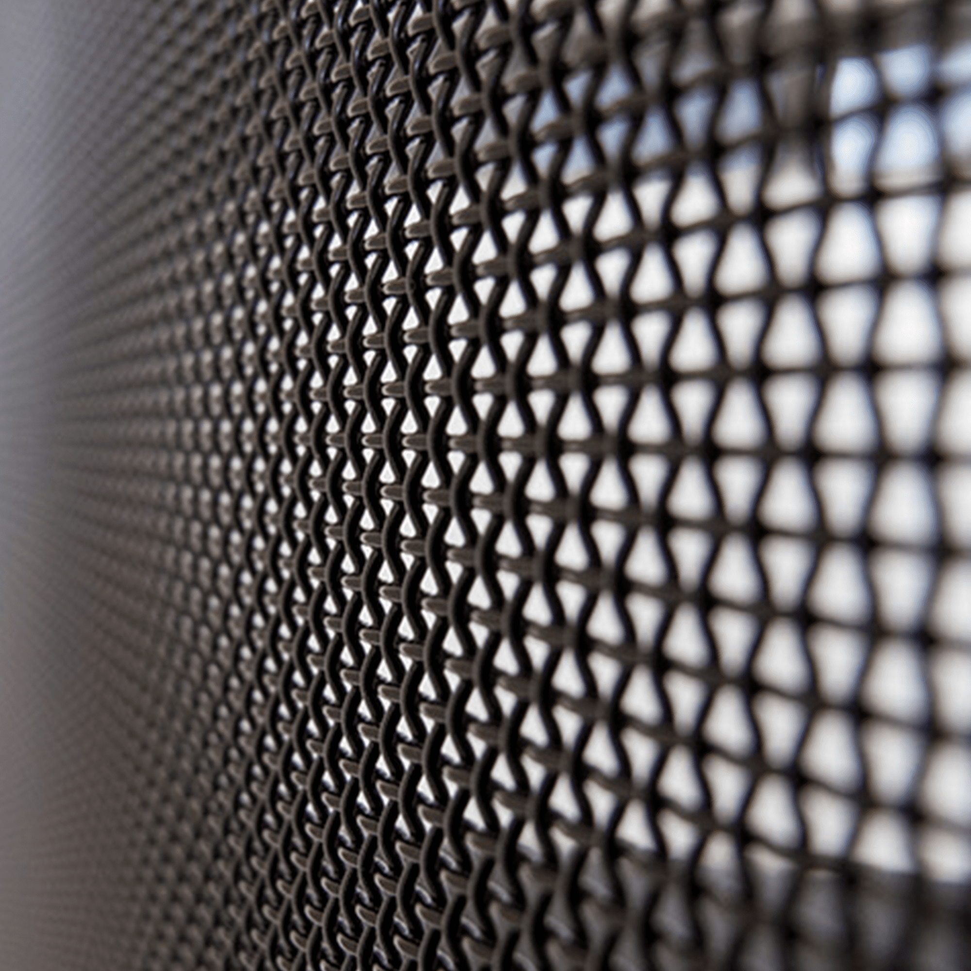 Close-up of woven stainless steel security mesh showing material quality
